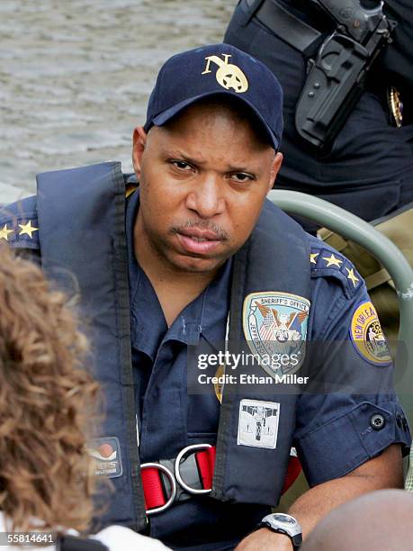 New Orleans Police Superintendent Eddie Compass tours the lower Ninth Ward District in a boat after it flooded during Hurricane Rita September 24,...