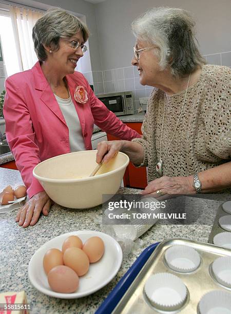 Britain's Health Secretary Patricia Hewitt speaks to client-user Jean Evans during a visit to Knoll House intermediate rehabilitation centre in Hove...