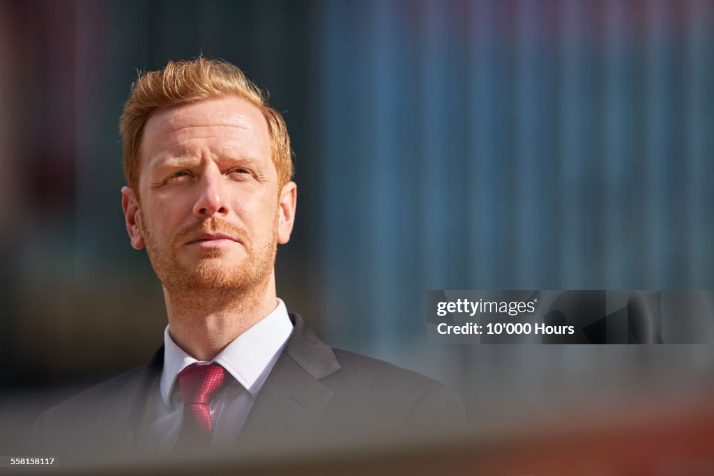 Portrait of a business man outside in the city