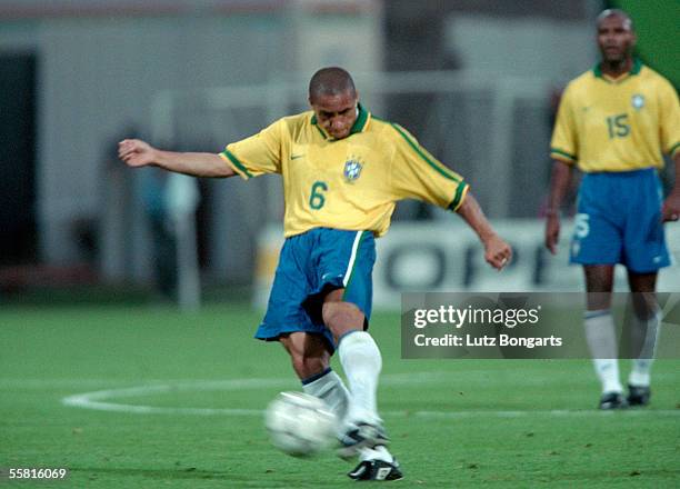Roberto Carlos of Brazil takes a free kick during the match between France and Brazil in the Tournament de France at the Stadium de Gerland on June...