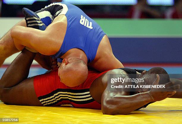 Turkish Aydan Polatci fights against Alexis Rodriguez of Cuba in 'Laszlo Papp' Sport Arena of Budapest 28 September 2005 during the free style final...