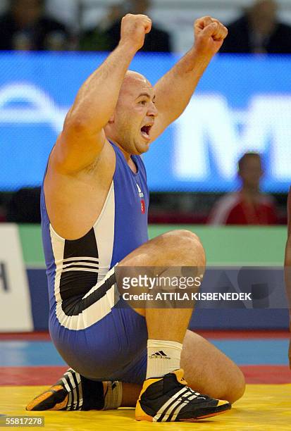 Turkish Aydan Polatci celebrates his gold medal against Alexis Rodriguez of Cuba in 'Laszlo Papp' Sport Arena of Budapest, 28 September 2005 during...