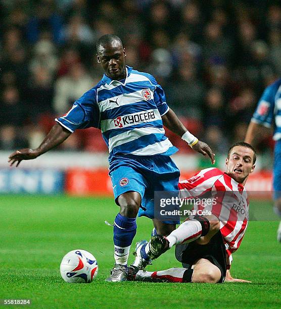 Matthew Oakley of Southampton tackles Leroy Lita of Reading during the Coca-Cola Championship match between Southampton and Reading at Friends...