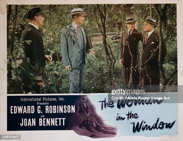 Poster for Fritz Lang's 1944 crime film 'The Woman in the Window' starring Raymond Massey and Edward G. Robinson.