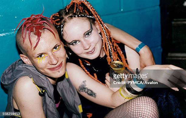 Two girls one drinking a can of strongbow Infest Bradford 1999.