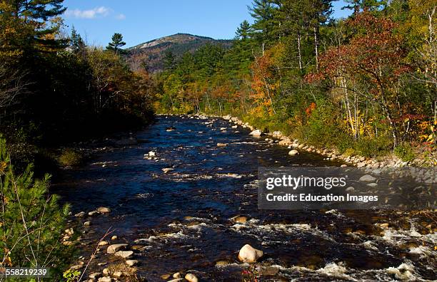 Kancamagus Highway, New Hampshire, near Conway Swift River with rocks and fall foliage