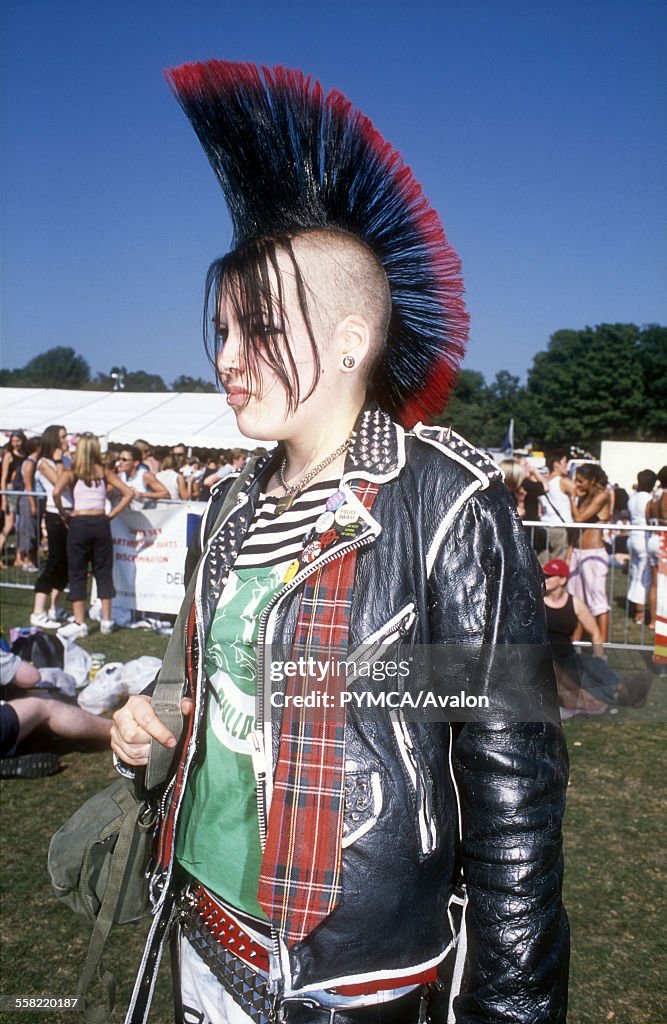 Punk girl at a festival with Mohican, UK, 2000s