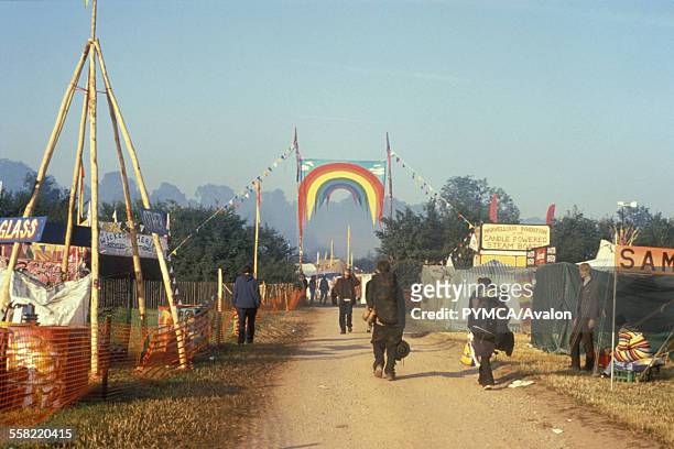 People walking up to the entrance of the Green Fields, Glastonbury Festival, UK, 1990s.