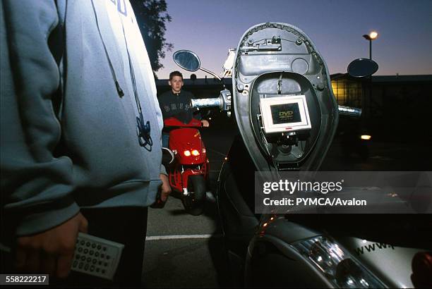 Player installed on a scooter, Luton, UK 2004.