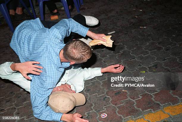 Drunk boys fighting in the street, Ibiza 2006.