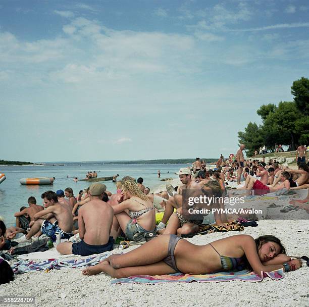 Girl sleeps on the beach at Outlook Festival 2010 in Croatia.