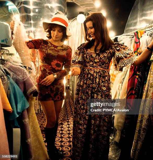 Two women looking at dresses in 'Stop the Shop', King's Road, Chelsea, London, 1971.