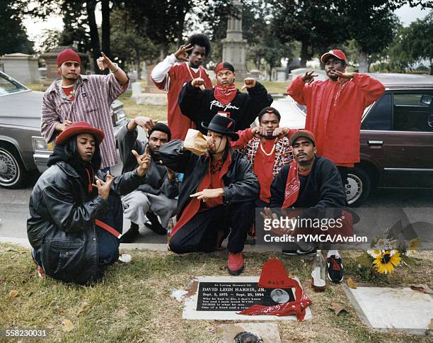 Rolling 20's Bloods Rolling 20's Bloods sitting in front of their homeboy's gravesite.