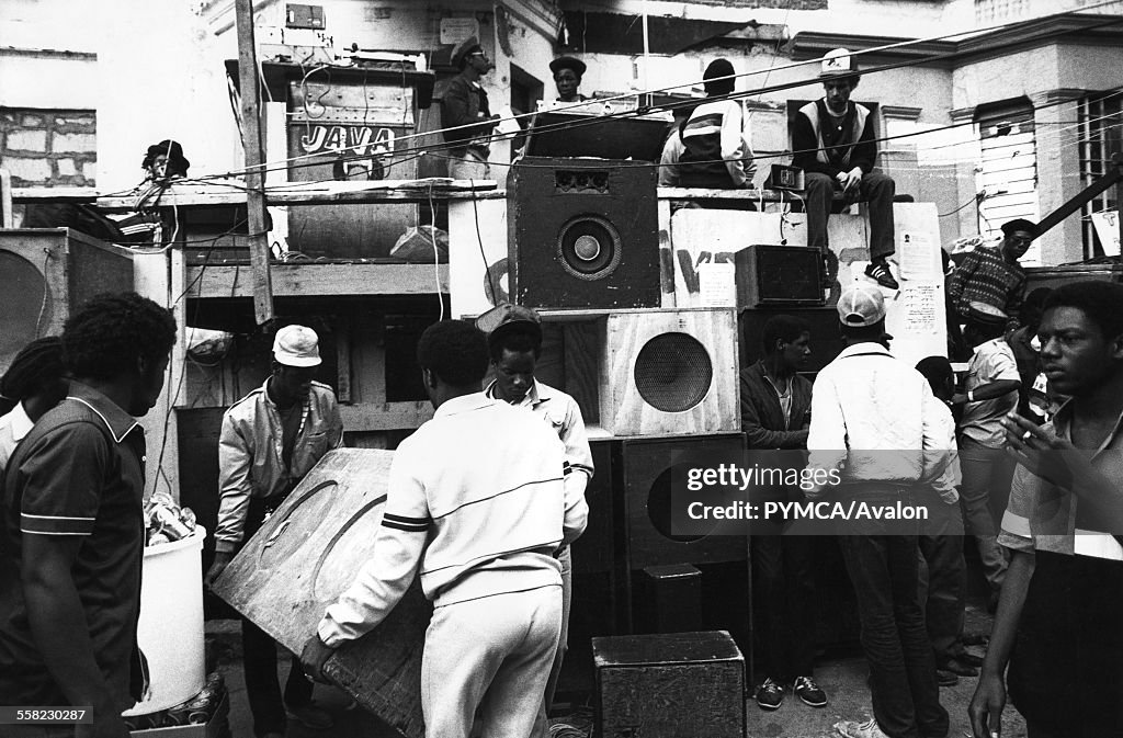 A group of people moving speakers, constructing a sound system Notting Hill, Carnival, London, UK, 1983