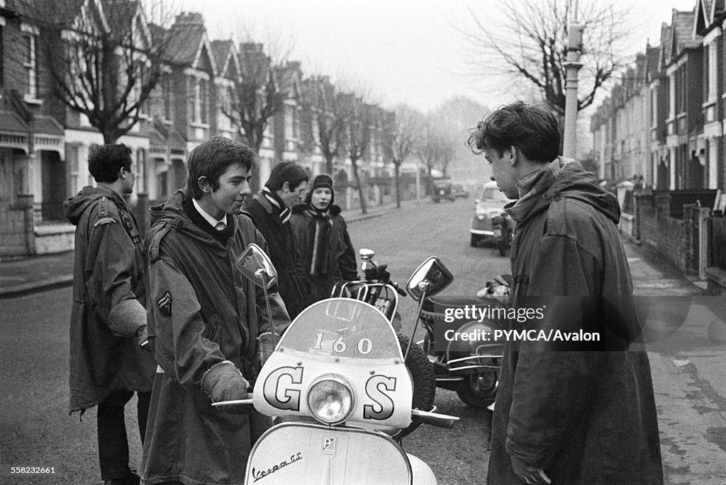 Teenage mods in parkas, on their Vespa scooters, London 1964