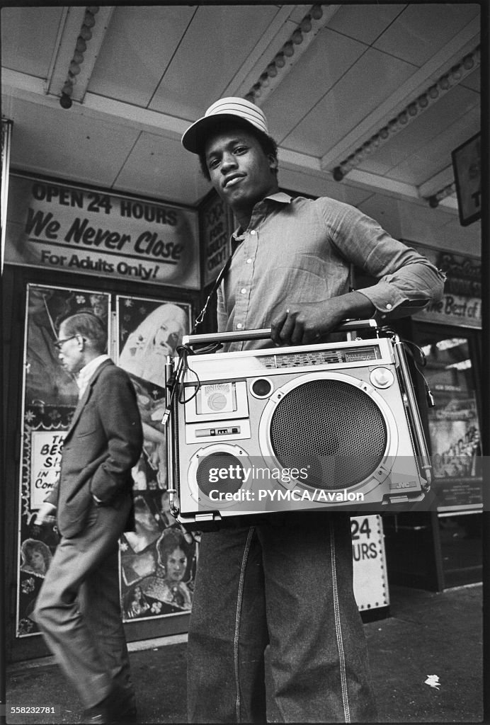 A teenager holding his ghetto blaster on 42nd street New York, USA, 1980