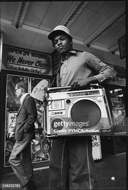 Teenager holding his ghetto blaster on 42nd street New York, USA, 1980.