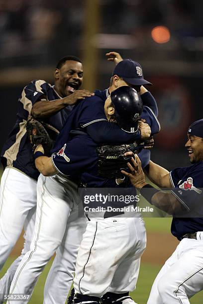 Closer Trevor Hoffman of the San Diego Padres is mobbed by teammates after the final out in the 9th inning against the San Francisco Giants as the...