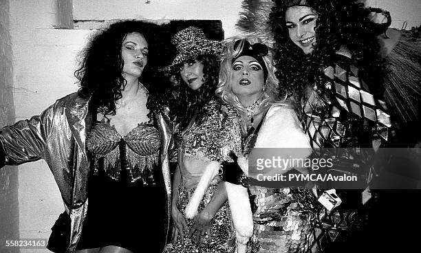 Drag queens and a friend hang out before a fashion show at Flesh in the Hacienda, Manchester 1989.