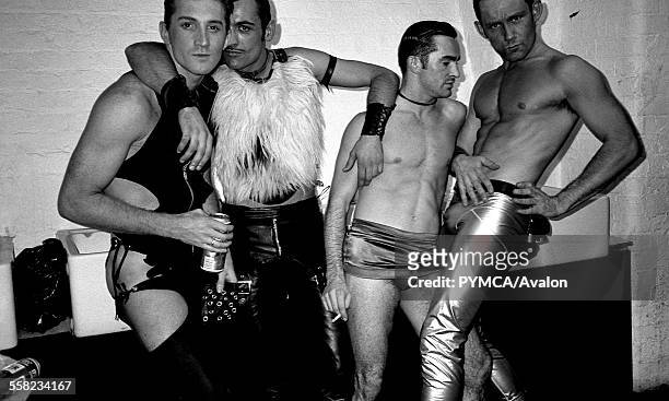 Clubbers hang out backstage before a fashion show at Flesh, the gay night at the Hacienda, Manchester 1989.