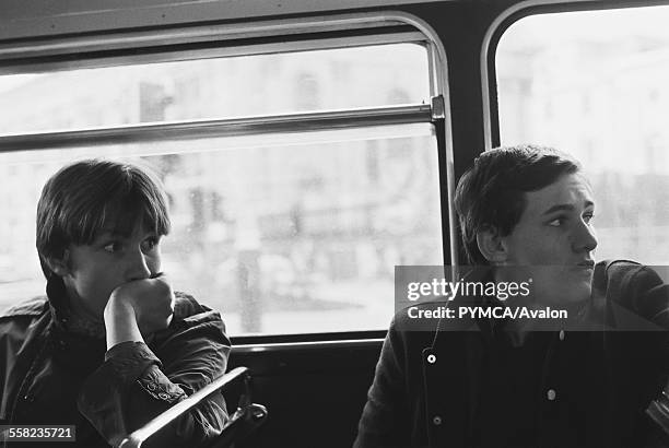 Two Teenage friends on top deck of London bus 1981.