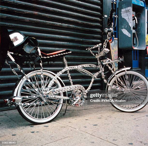 Schwinn bike leaning against some shuttered doors, USA.