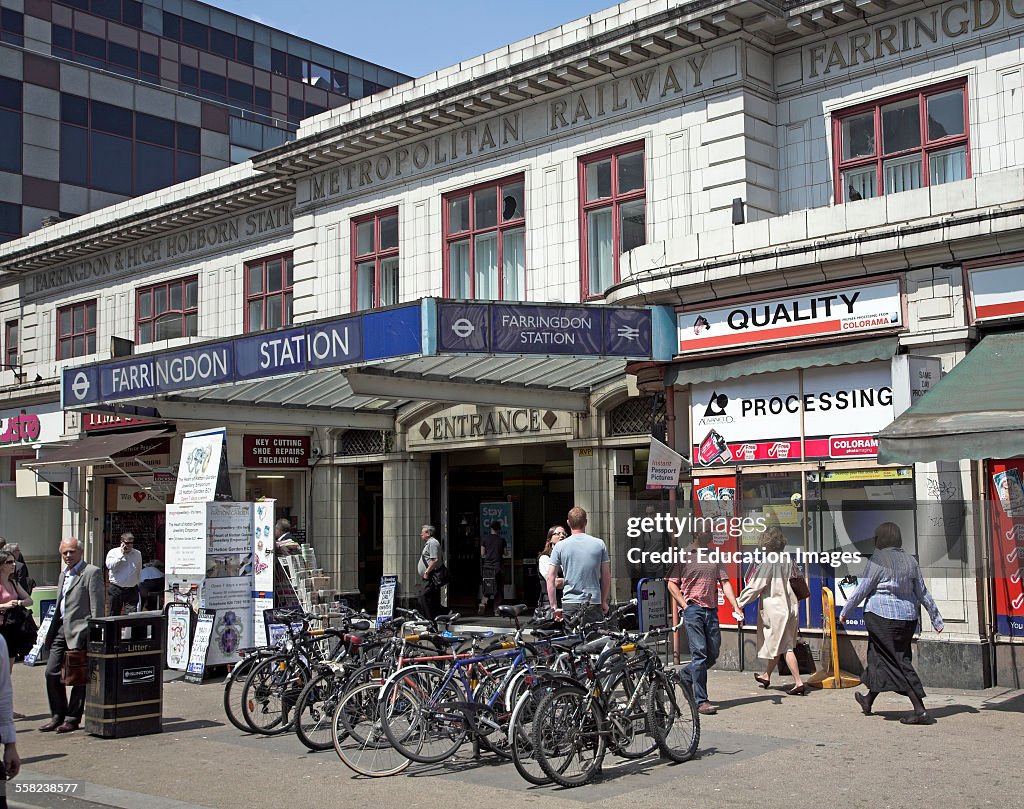 People in summer outside historic Farringdon railway station, London, England