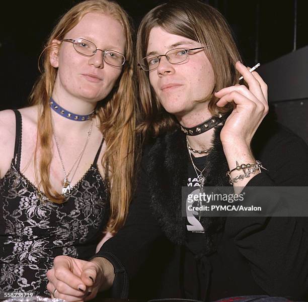 Goth couple wearing spike neck bands, Cardiff, UK 2000s.