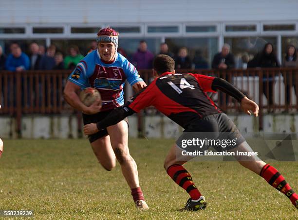 Amatuer rugby player carrying the ball, Bude, Cornwall