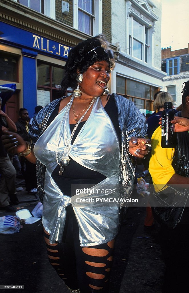 Woman dancing in the street Notting Hill Carnival London 1997