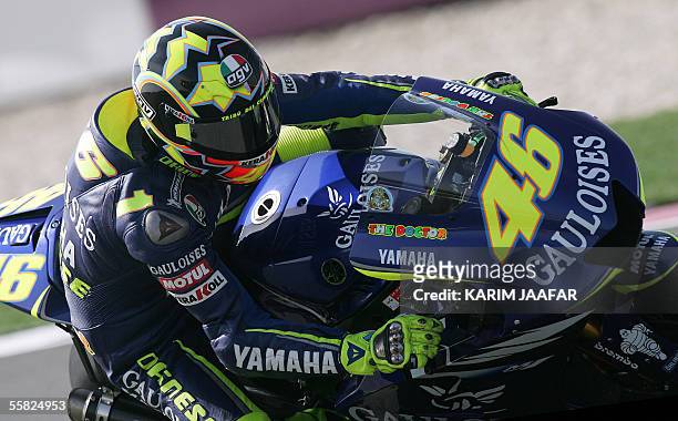 Italian rider and world champion Valentino Rossi of Yamaha speeds during a free practice session of Qatar Grand Prix World Championships in Doha 29...