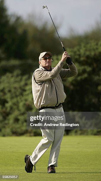 Actor Michael Douglas tees off on the 13th hole during the first round of the Dunhill Links Championships at the Carnoustie Golf Club, September 29,...