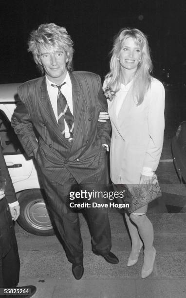 Singer Rod Stewart arrives at Ronnie Wood's birthday party with his girlfriend Kelly Emberg, June 1988.