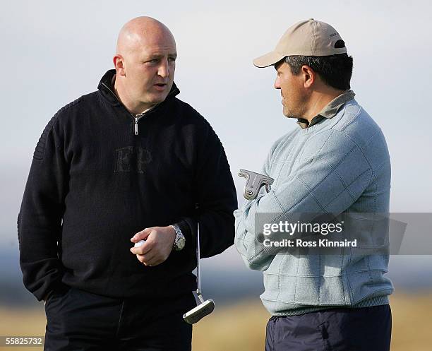 Ex rugby internationals Keith Wood of Ireland and Zinzan Brooke of New Zealand wait to putt on the par four 17th hole during the first round of the...