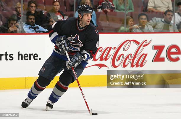 Todd Bertuzzi of the Vancouver Canucks handles the puck during the NHL preseason game against the San Jose Sharks at General Motors Place on...