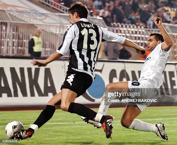 Maccabi Petach Tikva's Toama Salim vies with Partizan Belgrad's Lomic Marko during their UEFA Cup first round second leg football match 29 September...