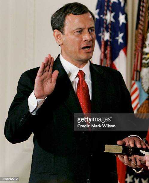 John Roberts is sworn in as Chief Justice of the United States Supreme Court during a ceremony in the East Room at the White House September 29, 2005...