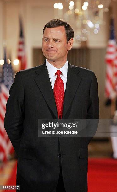 John Roberts listens as U.S. President George W. Bush introduces him as the new Chief Justice of the U.S. During a swearing in ceremony in the East...
