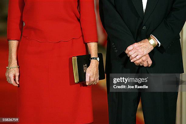 Jane Roberts holds a bible as she stands with Associate Justice, John Paul Stevens, before he swears in John Roberts as Chief Justice of the U.S....
