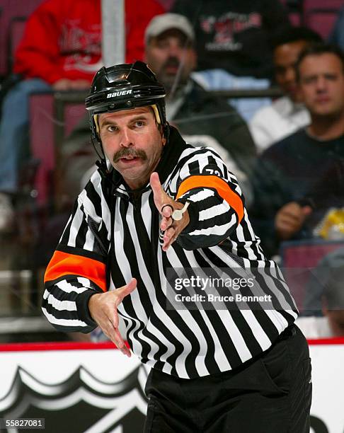 Referee Bill McCreary makes a call during a preseason game between the New Jersey Devils and the New York Rangers at the Continental Airlines Arena...