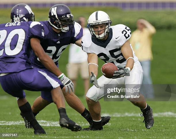 Wide receiver Brendan Perretta of the Penn State Nittany Lions attempts to make a reception against Brendan Smith and Marquice Cole of the...