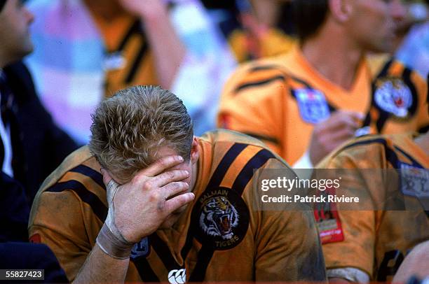 Paul Sironen of the Tigers looks dejected on the bench during the 1989 NSWRL Grand Final between the Canberra Raiders and the Balmain Tigers held at...