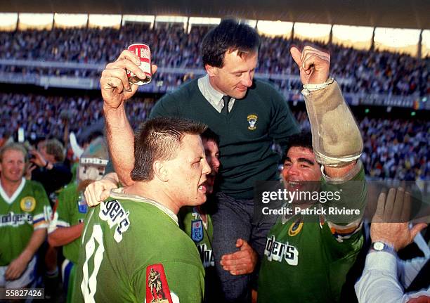 Tim Sheens, coach of the Raiders is chaired up by Glenn Lazarus and Mal Meninga after winning the 1989 NSWRL Grand Final between the Canberra Raiders...