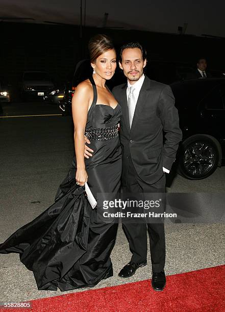 Actress Jennifer Lopez and her husband singer Marc Anthony arrive at the 2005 Macy's Passport Gala held at Barker Hanger on September 29, 2005 in...