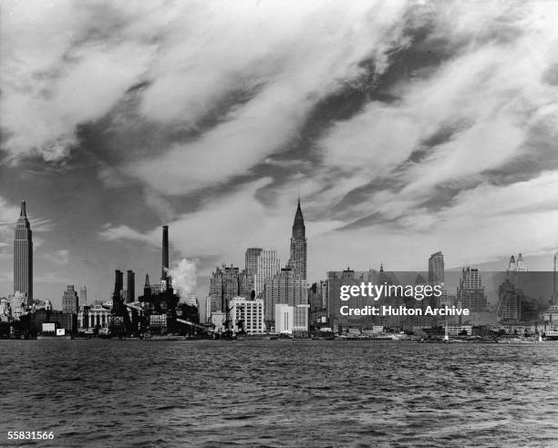 General view of the East Midtown skyline from across the East River looking West, New York, New York, 1930s or 1940s. Prominant structures include...