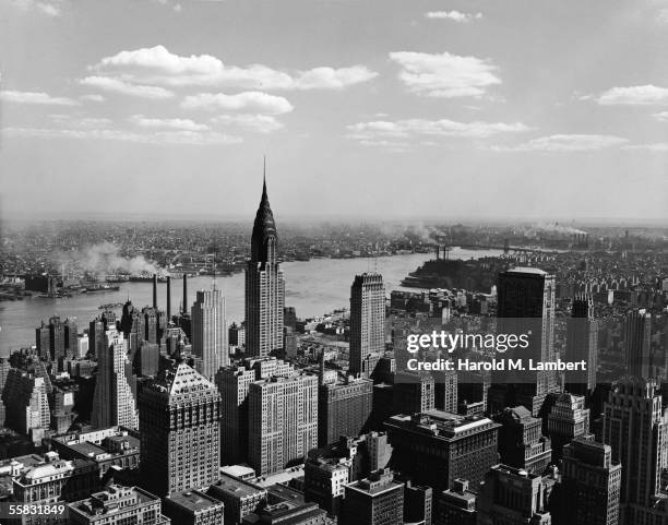 High angle view of the East Midtown skyline looking across the East River towards Queens and Brooklyn, New York, New York, 1930s or 1940s. Prominant...