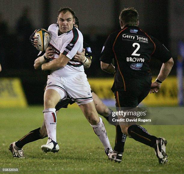 Andy Goode of Leicester takes on Andrew Brownduring the Powergen Cup match between Newport-Gwent Dragons and Leicester Tigers at Rodney Parade on...
