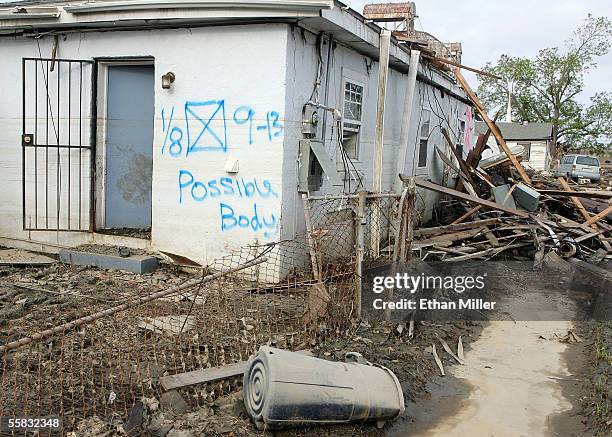 Home spray painted by search crews is seen in the Lower Ninth Ward near the damaged levee along the Industrial Canal September 30, 2005 in New...