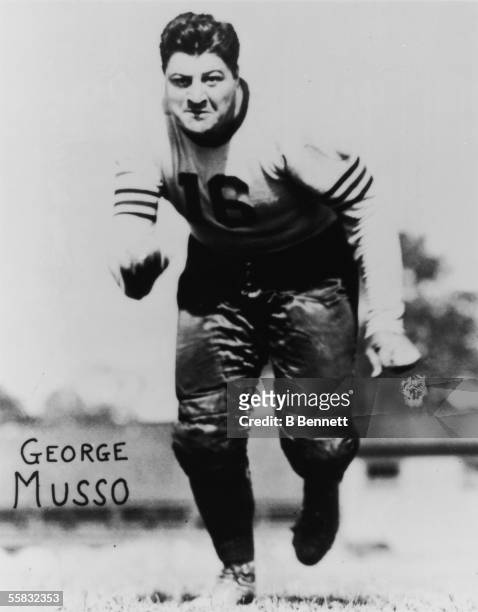 American pro football player George Musso , tackle and defensive guard for the Chicago Bears from 1933 - 1944, runs towards the camera in this...