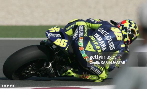 Italian rider and world champion Valentino Rossi of Yamaha speeds during the Qatar Grand Prix World Championships 01 October 2005, at the Losail...